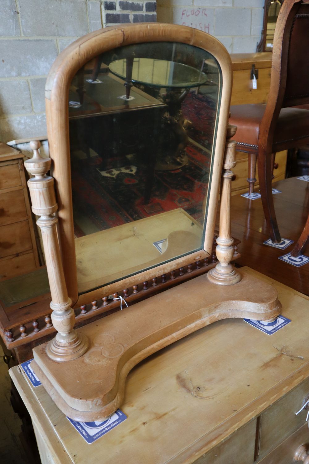 A late Victorian pine four drawer chest, width 83cm, depth 45cm, height 77cm together with a pine toilet mirror